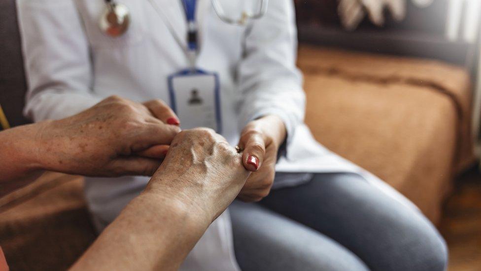 Stock photograph of nurse with patient