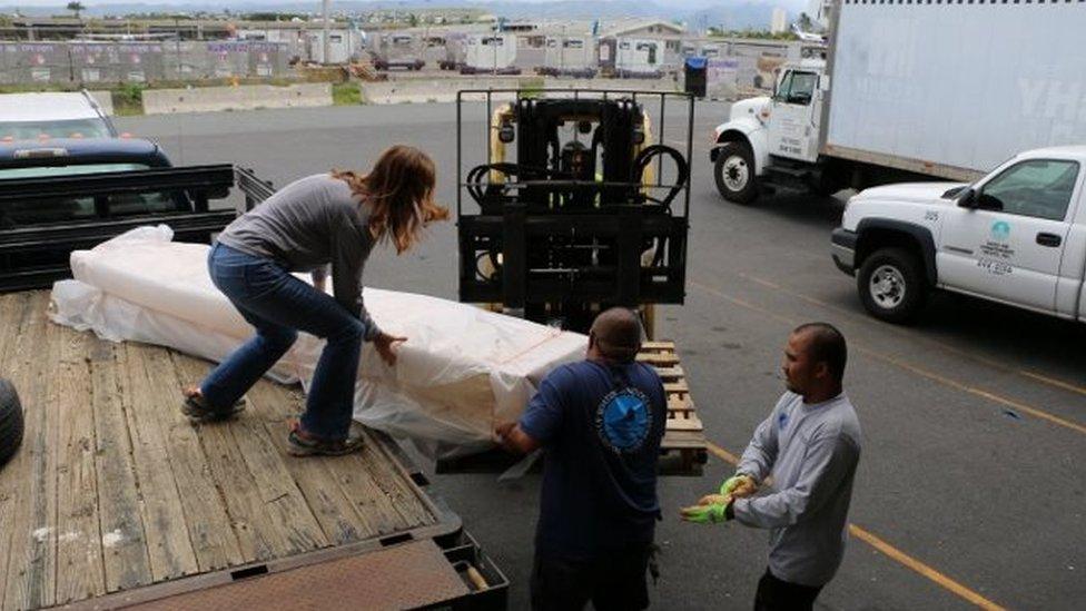 The sign being removed from a truck, to be flown to Japan