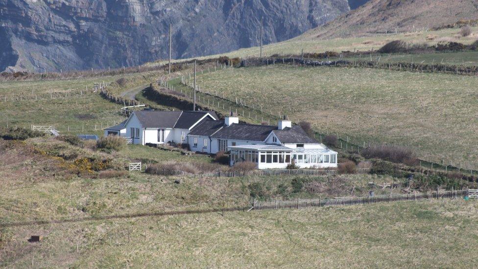 The current building overlooking Ceibwr Bay