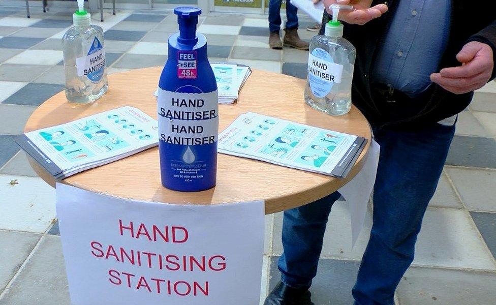 Hand sanitising station at show