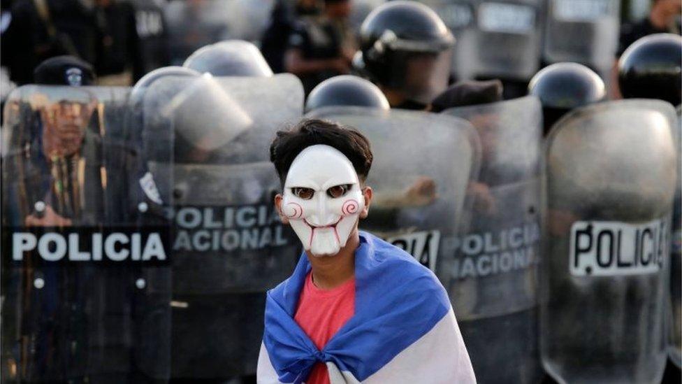 A masked youngster protests against Nicaraguan President Daniel Ortega in Managua on 13 September, 2018.