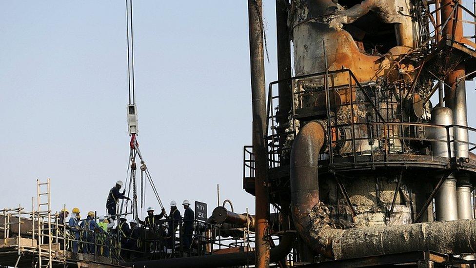 Workers are seen at the damaged site of Saudi Aramco oil facility in Abqaiq, Saudi Arabia, September 20, 2019