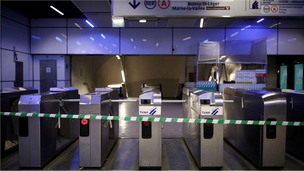 A closed entrance of the Charles de Gaulle-Etoile RER train station is seen during a strike by French transportation workers in Paris on 5 December, 2019.