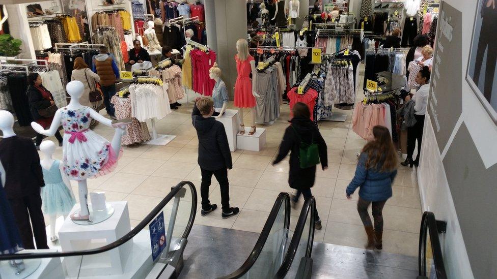 Bottom of escalator and shop floor