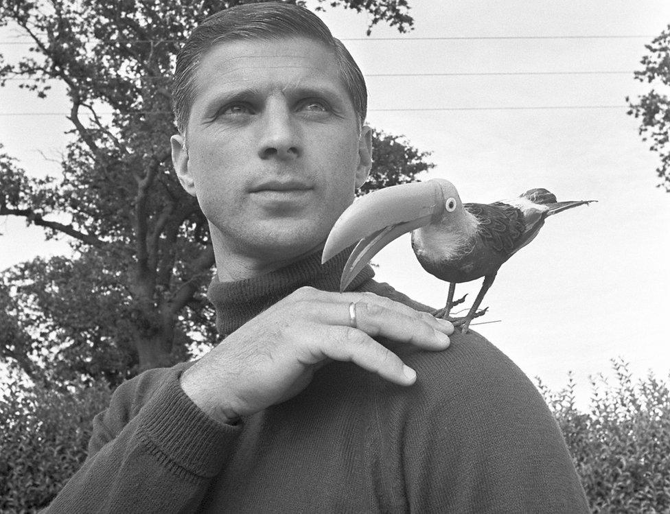 Bulgaria 1966 World Cup squad goalkeeper Georgi Naidenov poses with the team's lucky mascot, a plastic toucan on 12 July 1966