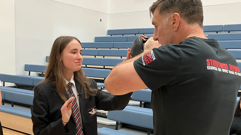 Tegan trying out self-defence training with Dene Josham