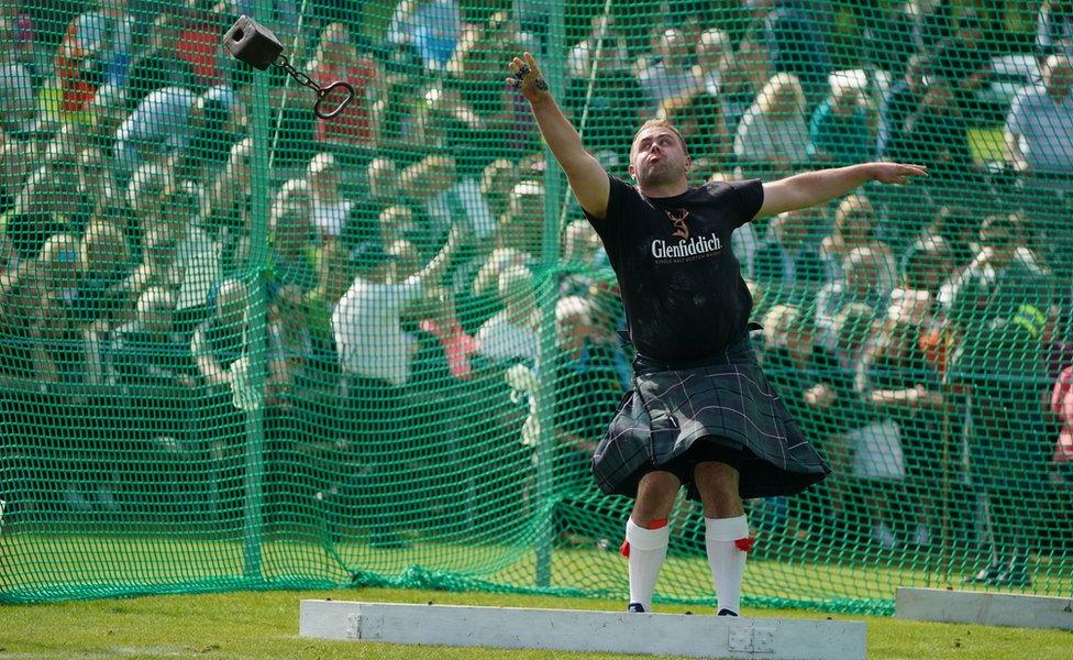 A competitor tosses the hammer during the Braemar Gathering