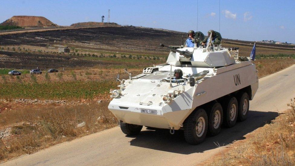 United Nations peacekeeping forces patrol a road near the Israeli-Lebanese border