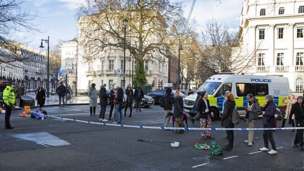 Police cordoned off the road while the protesters had occupied the mansion