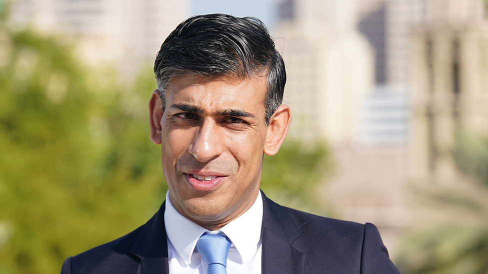 Rishi Sunak speaking on the roof of the British Embassy in Dubai on Friday