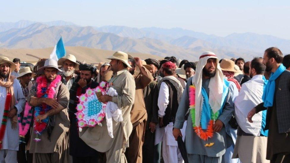 Marchers with a mountainous scenic backdrop in Wardak district, Afghanistan on 14 June 2018