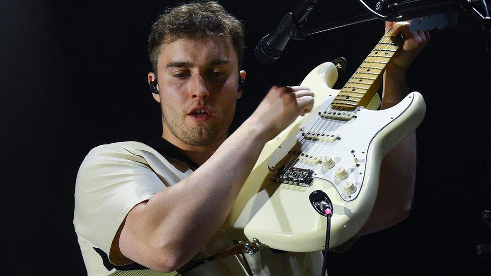 Sam Fender plays guitar