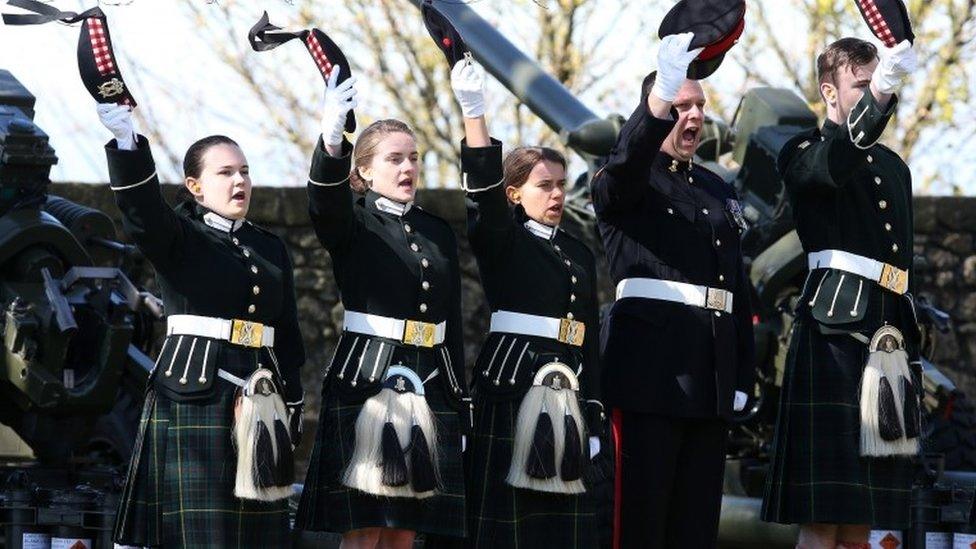 Cadets at Edinburgh Castle doff caps after firing salute