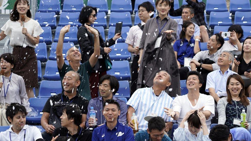 Spectators enjoying the summer snow