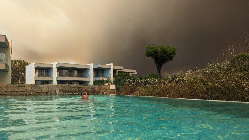 Black smoke in the sky at the family's hotel