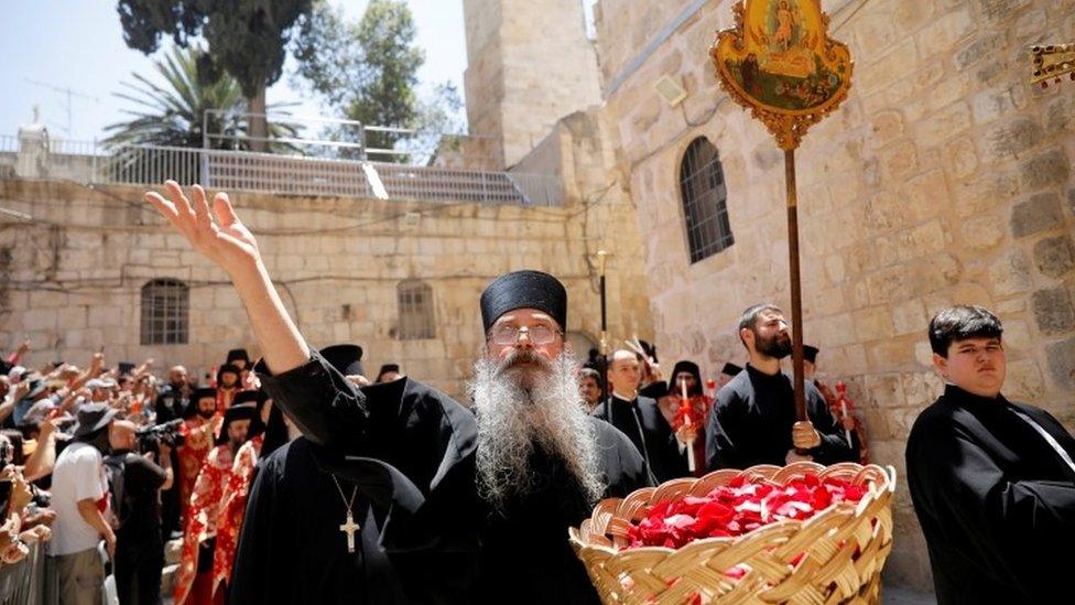 A member of the Greek Orthodox clergy at the Church of the Holy Sepulchre in Jerusalem's Old City