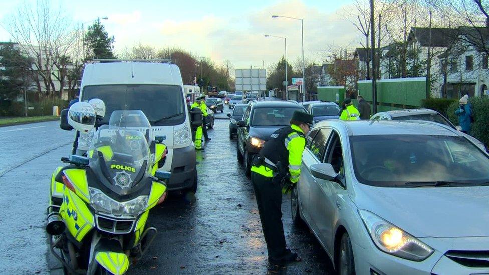 Police talking to a driver