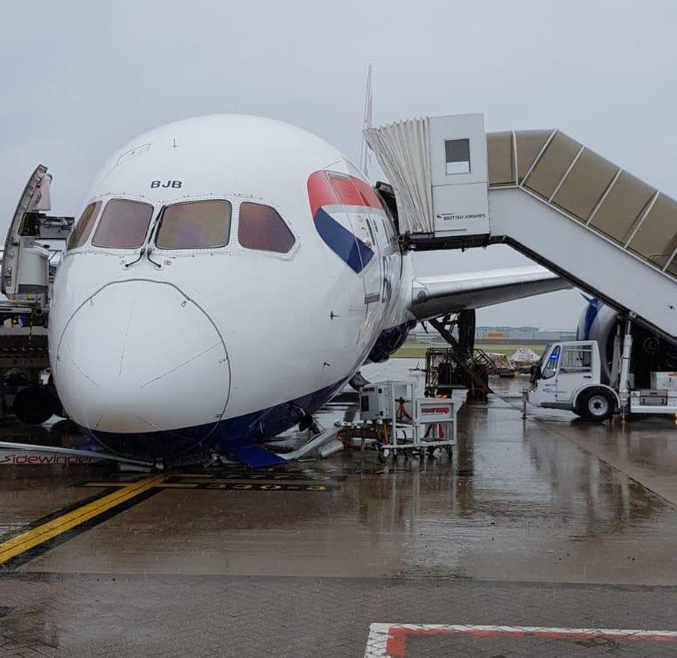 BA plane with nose tipping forward