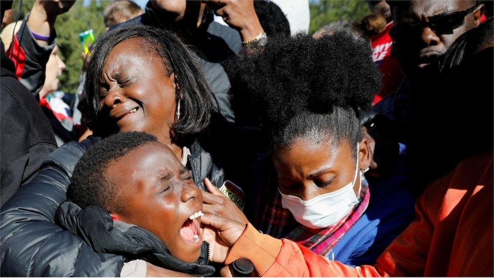 People react outside the Glynn County Courthouse after the jury reached a guilty verdict