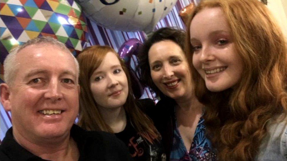 Ellen with her parents and sister