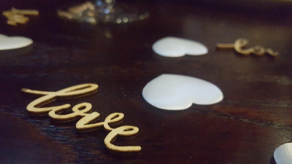 Love confetti on a table