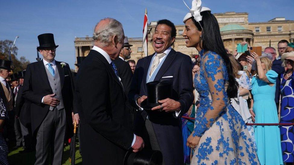 The King meets Lionel Ritchie in the garden of Buckingham Palace