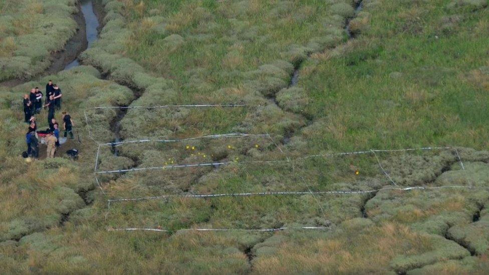 Officers on Foulness island where her remains were found