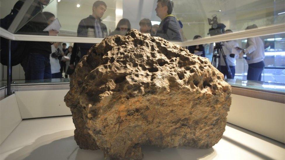 Part of the Chelyabinsk meteorite in Russia, recovered from Lake Chebarkul, in a museum on 18/10/2013