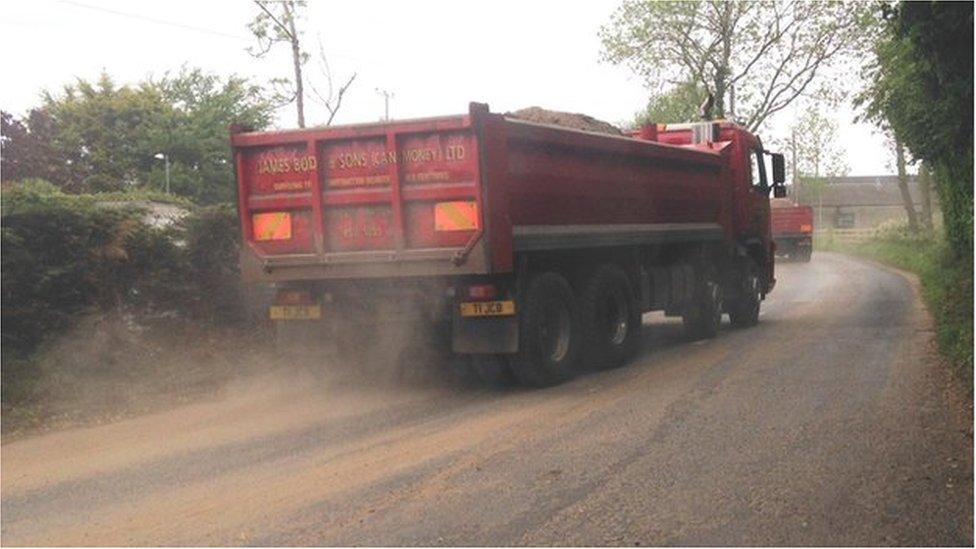 Truck driving sand away