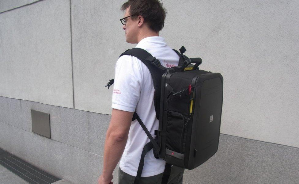 Man carrying backpack