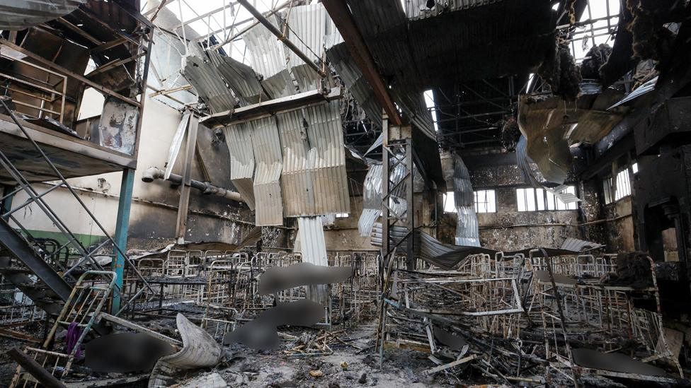 Bodies of detainees lie among debris following the shelling at a pre-trial detention centre in the course of Ukraine-Russia conflict, in the settlement of Olenivka in the Donetsk Region, Ukraine July 29, 2022.