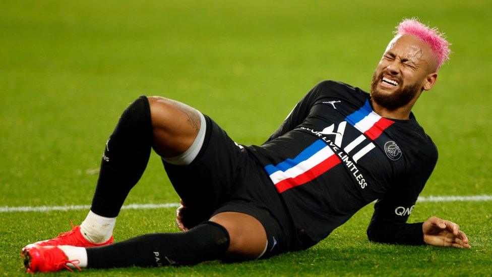 Neymar lying on floor wincing