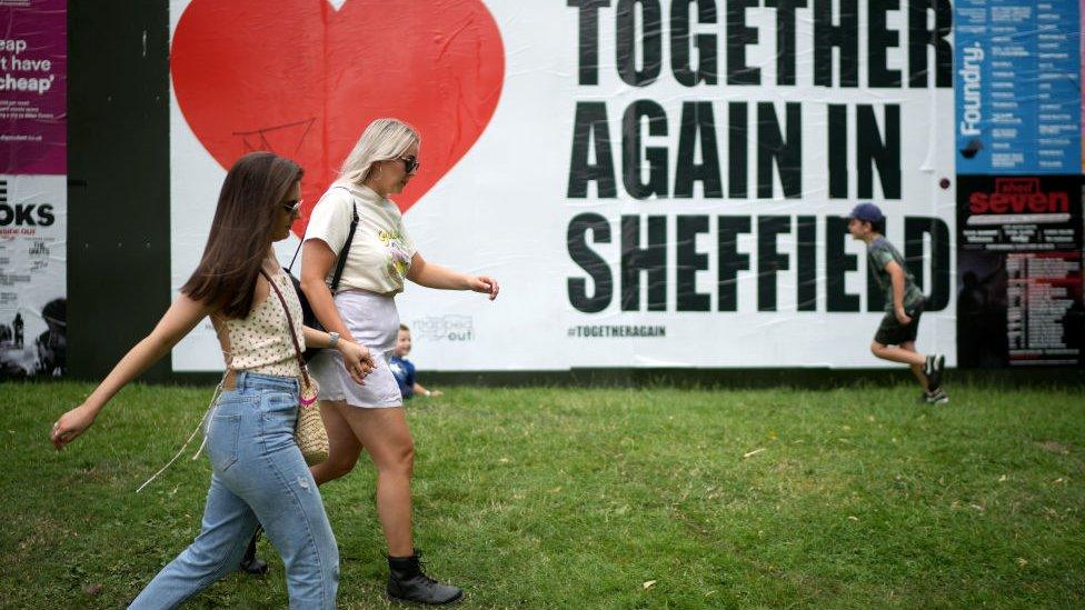 Sign at festival celebrating people being allowed to meet up