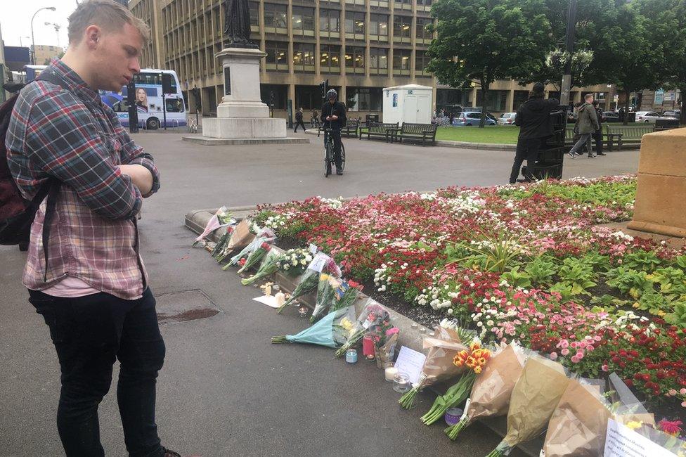 Man looking at flowers