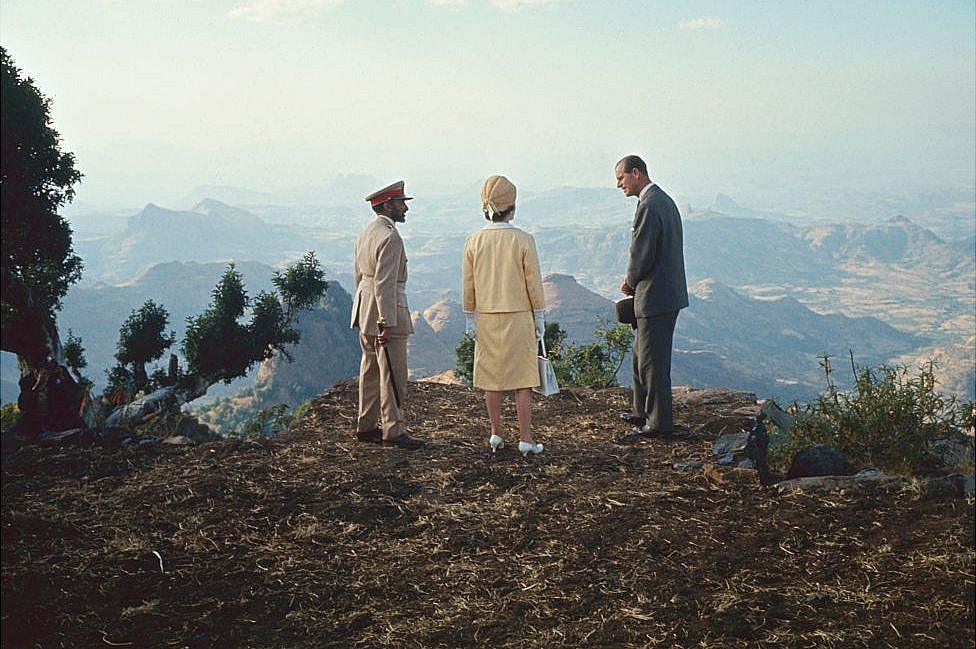 Emperor of Ethiopia Haile Selassie (1892 - 1975), Queen Elizabeth II, and her husband, Prince Philip, Duke of Edinburgh stand on a cliff that overlooks Blue Nile Falls, near Lake Tana, Ethiopia, 5 February 1965.