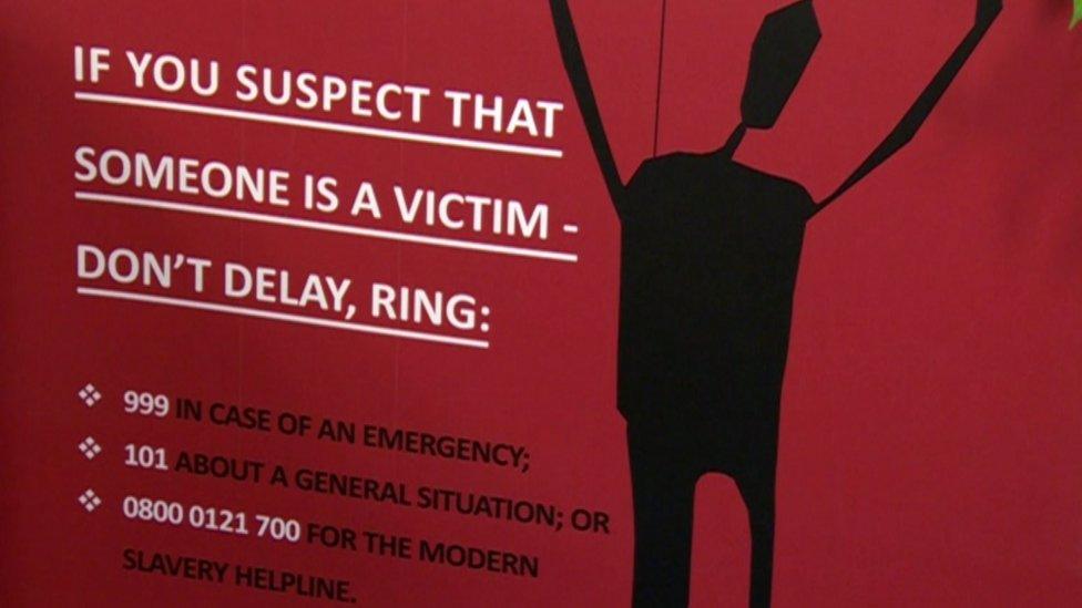 Modern slavery poster appealing for public assistance