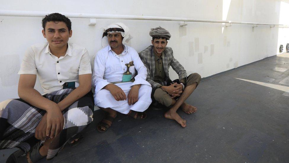 Three Yemeni men sit down in a section of the deck of the Galaxy Leader cargo ship, seized by the Houthis offshore of the Al-Salif port on the Red Sea in the province of Hodeidah, Yemen, 05 December 2023.