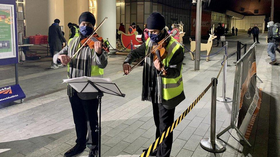 Volunteers perform music