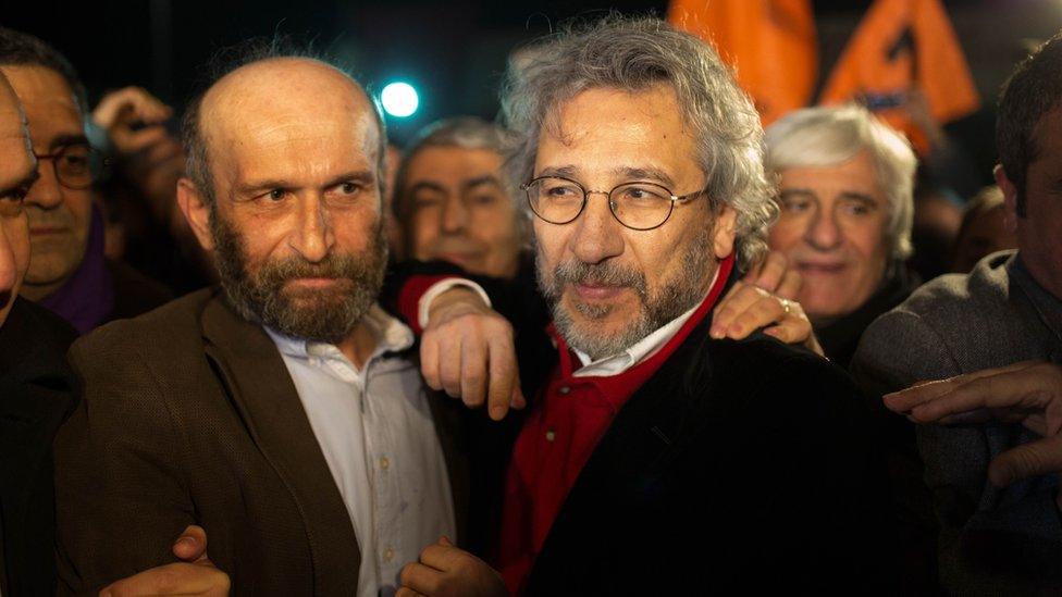 Can Dundar (R), the opposition Cumhuriyet daily's editor-in-chief and Erdem Gul (L),Cumhuriyet daily's Ankara bureau chief talk to the press after being freed from Silivri prison in Istanbul on February 26,2016