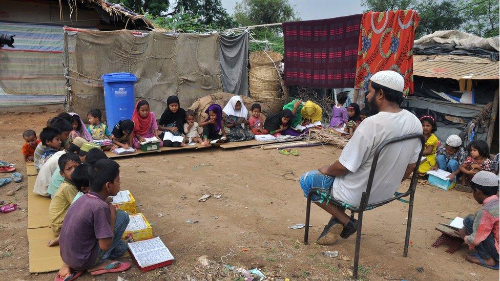 Rohingya Muslim refugee children from Myanmar study at a makeshift madrasa (religious school) on World Refugee Day in the outskirts of the Indian city Jammu on June 20, 2017.