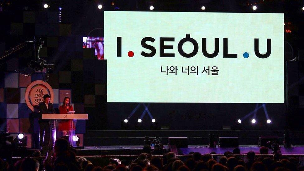 The slogan on a big screen at the even announcing the winner