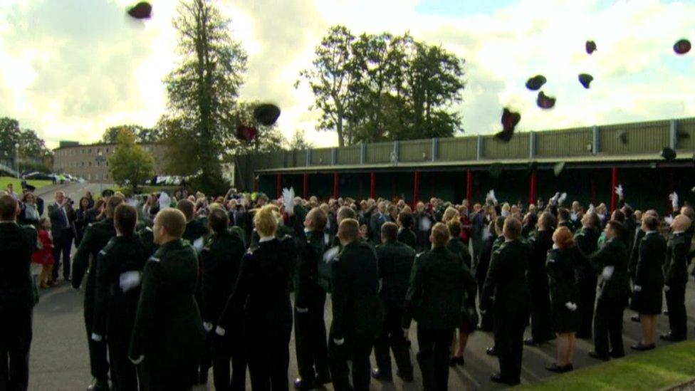 PSNI officers throw their hats at graduation ceremony