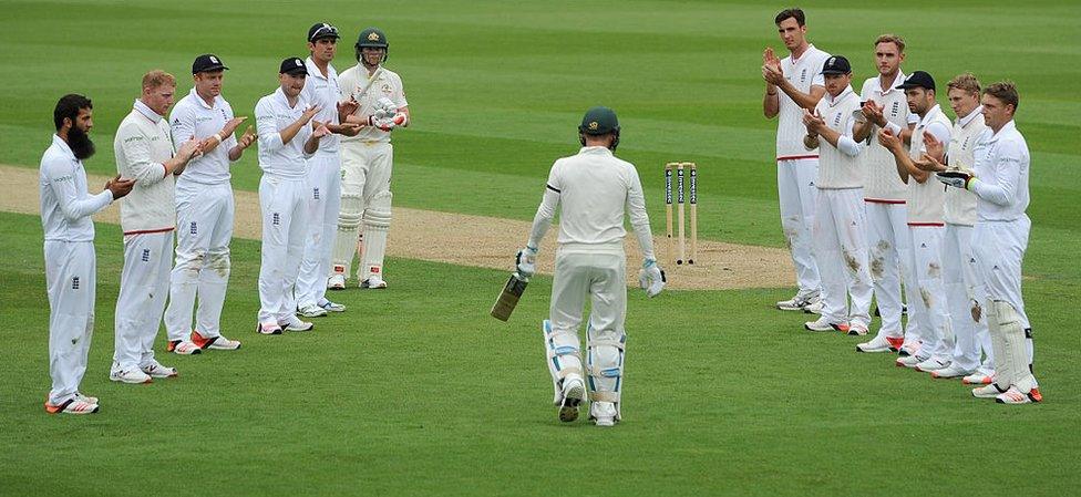 England players form a guard of honour as Michael Clarke walks out to bat in his final Test