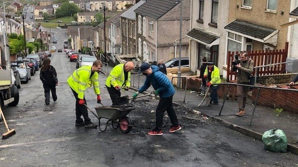 Swansea council workers and the community begin the clean-up