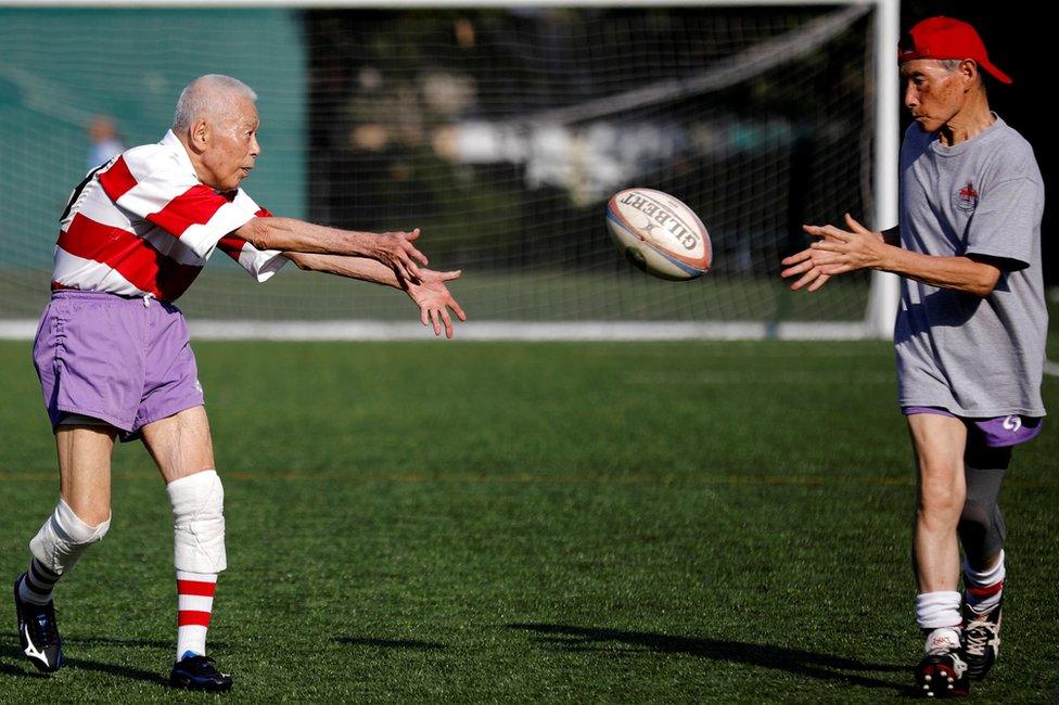 Members of Tokyo's Fuwaku Rugby Club train outdoors