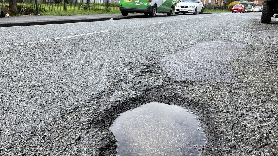 Pothole in road