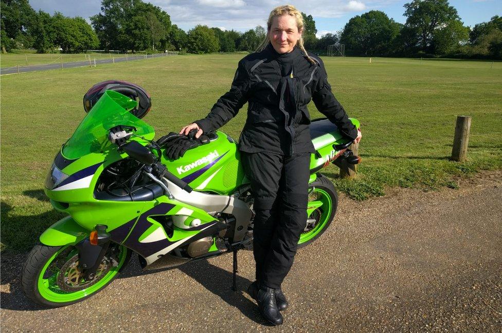 Patricia Stiemke in front of a motorbike