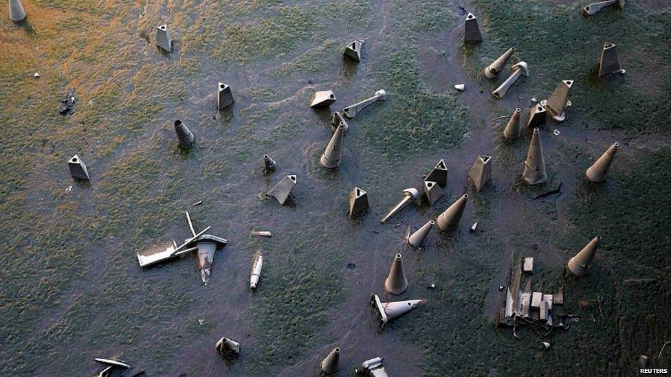 Traffic cones on the banks of the River Thames in London