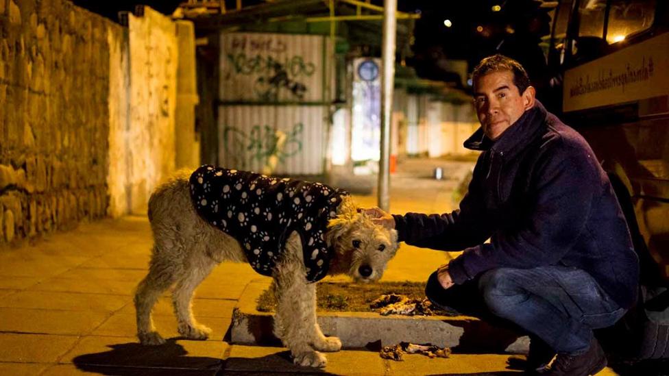 Ferchy and one of the dogs he feeds