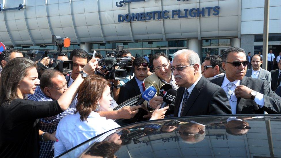 Egyptian Prime Minister Sherif Ismail talks to reporters at Cairo International Airport, Thursday, 19 May, 2016.